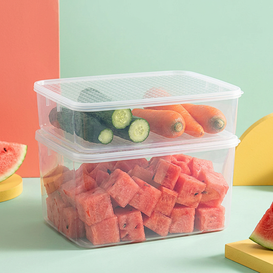 Clear refrigerator containers with colorful produce on mint background