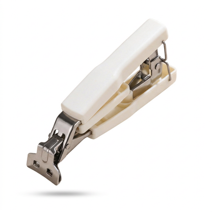 Ivory-handled metal plate gripper isolated on white